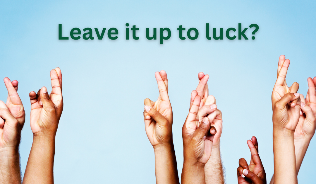 Image with light blue background and several raised hands with crossed fingers and the title, "Leave it up to Luck" above.